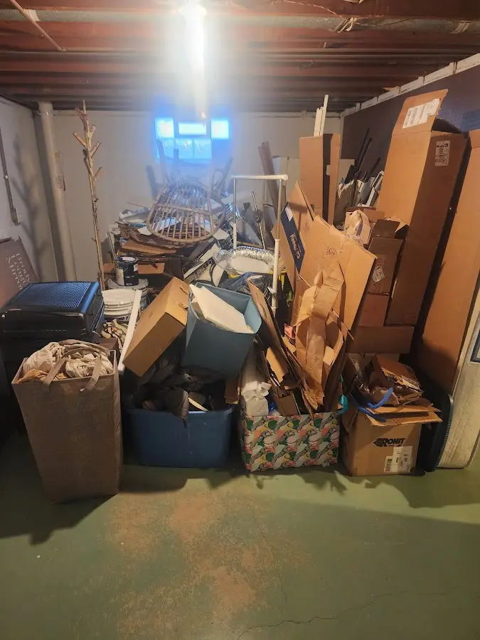 Roll-off dumpster container at job site for Yard Waste Dumpster Rental in West Warwick