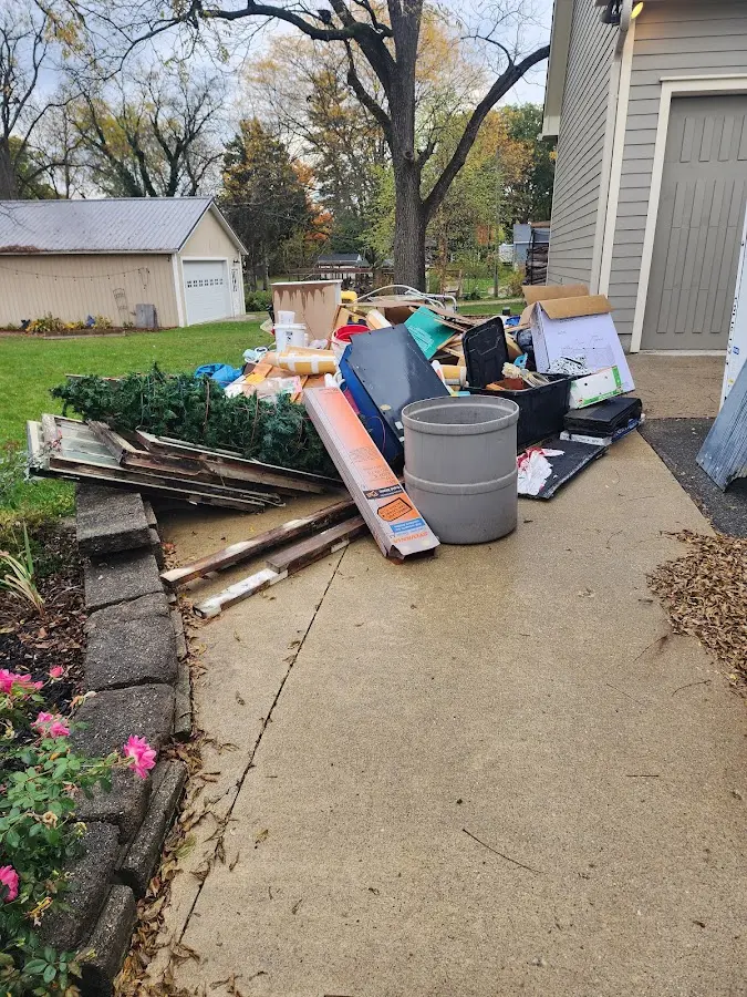 Dumpster being loaded with debris for 30 Yard Dumpster Rental in West Warwick